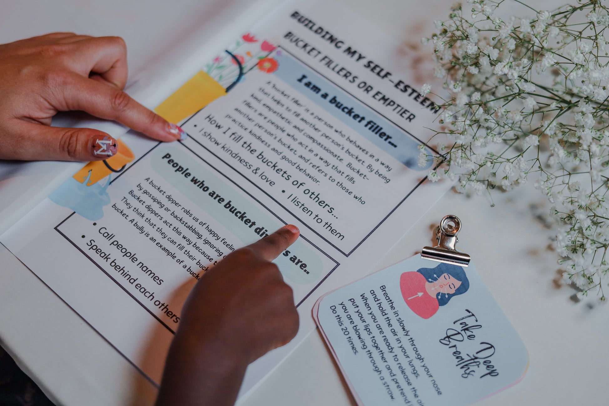 Parent and child reading on how to build my self esteem